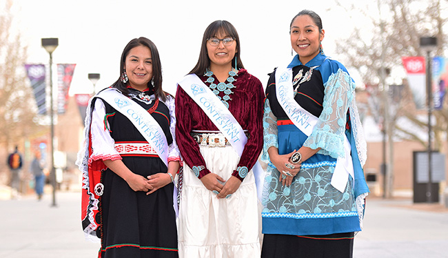 image of three ladies competing in the Miss Indian UNM pageant